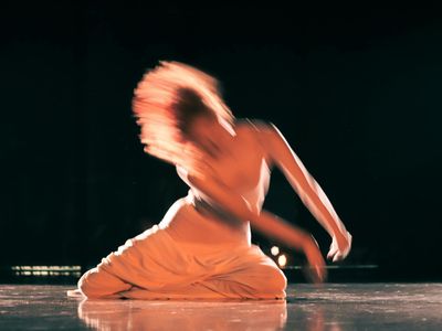 A blurry motion shot of someone performing a dynamic movement.